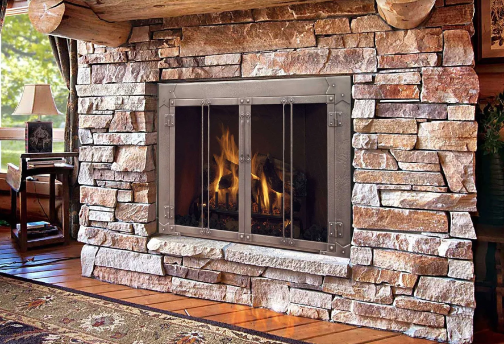 Fireplace glass doors installed on stone fireplace